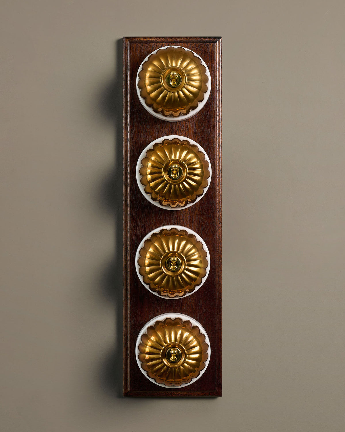 The Jelly Toggle Switch (4 Gang Row & Mahogany Finish Pattress) - Heirloom Brass with White Base. TEST