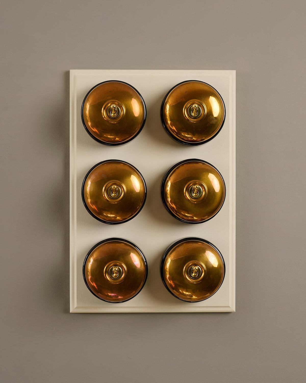 The Dolly Toggle Switch (6 Gang & Primed Maple Pattress) - Heirloom Brass with Black Base. TEST