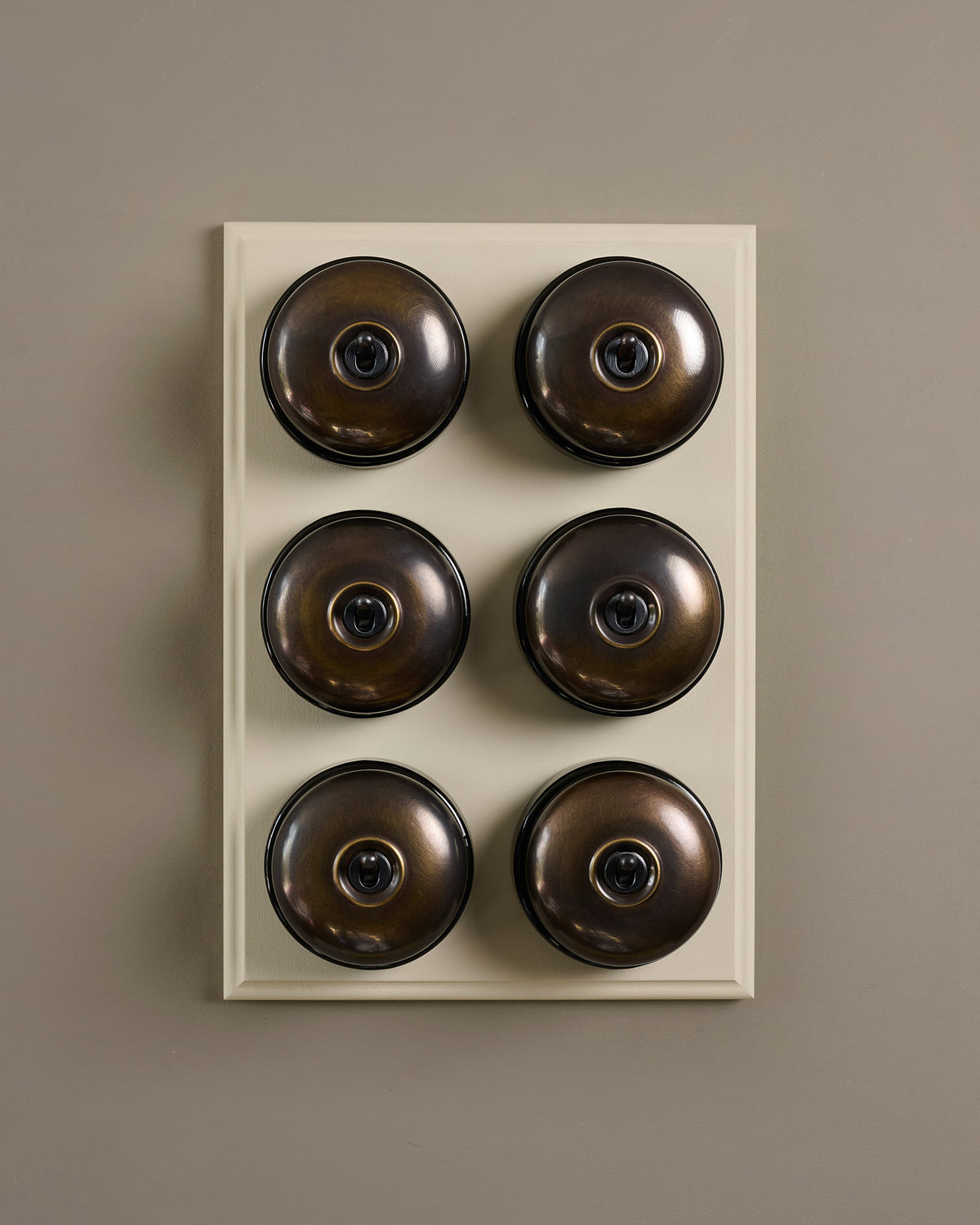 The Dolly Toggle Switch (6 Gang & Primed Maple Pattress) - Oxidised Brass with Black Base. TEST