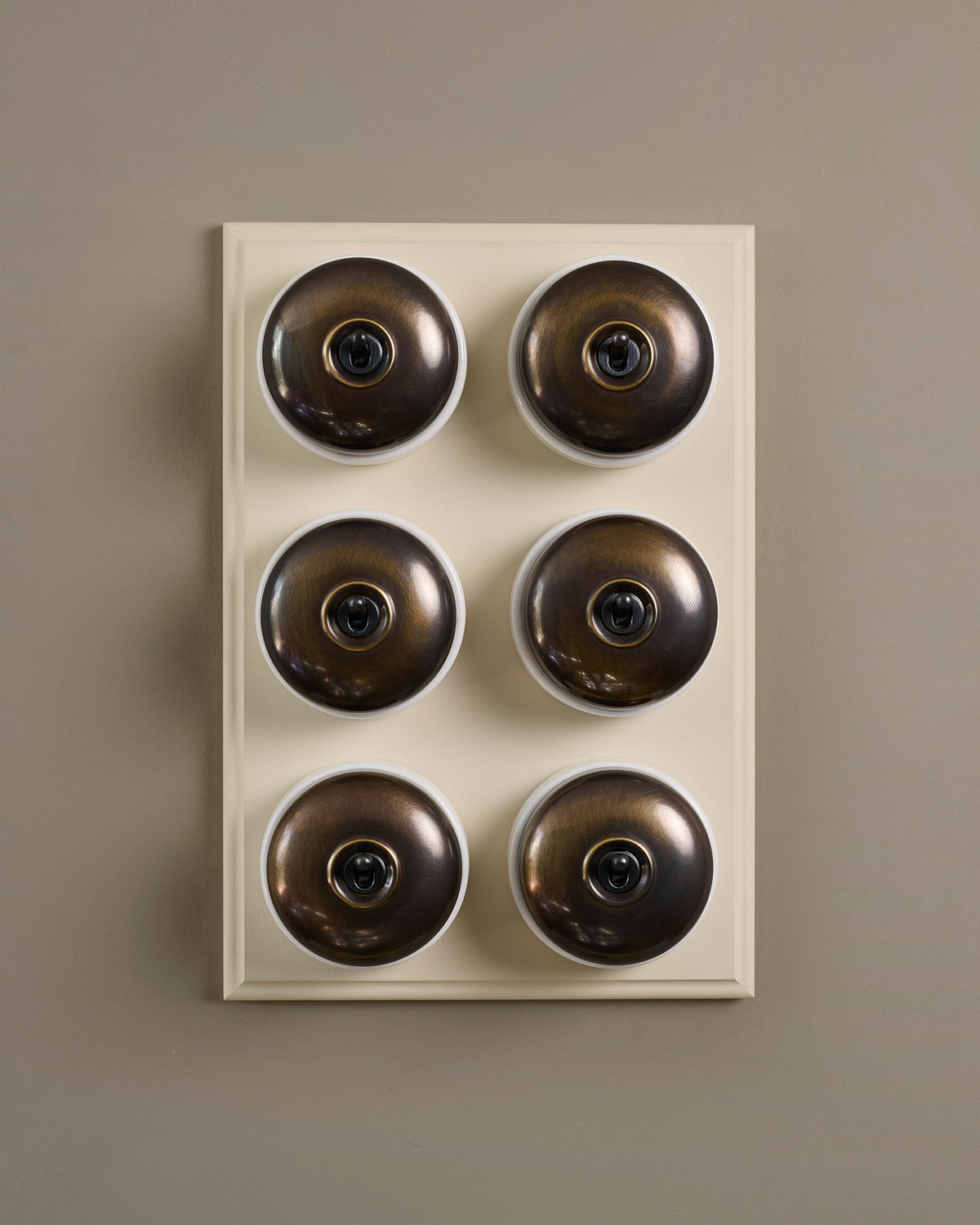 The Dolly Toggle Switch (6 Gang & Primed Maple Pattress) - Oxidised Brass with White Base. TEST