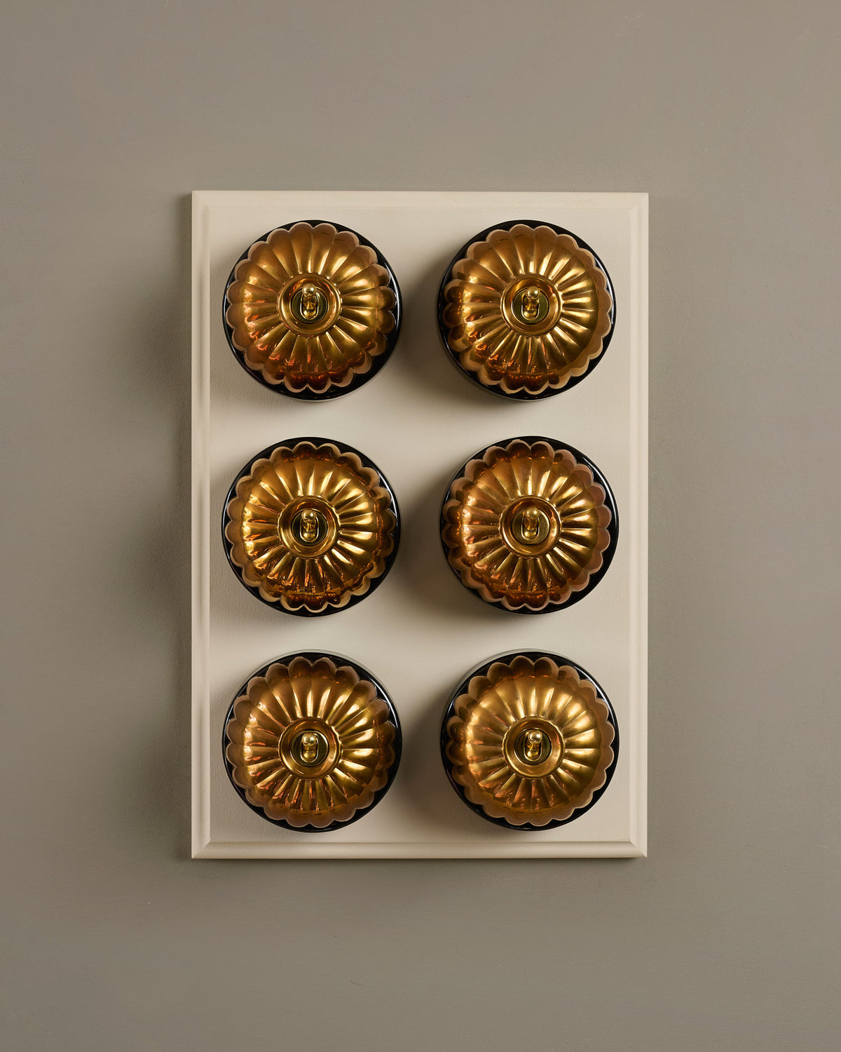 The Jelly Toggle Switch (6 Gang & Primed Maple Pattress) - Heirloom Brass with Black Base. TEST