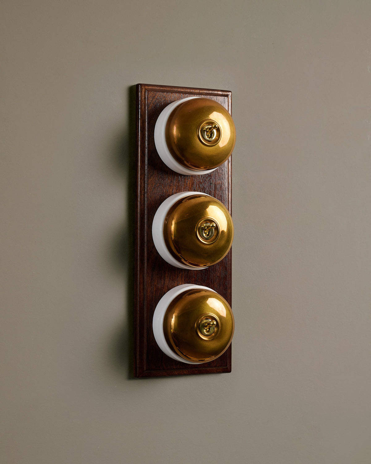 The Dolly Toggle Switch (3 Gang & Mahogany Finish Pattress) - Heirloom Brass with White Base. TEST