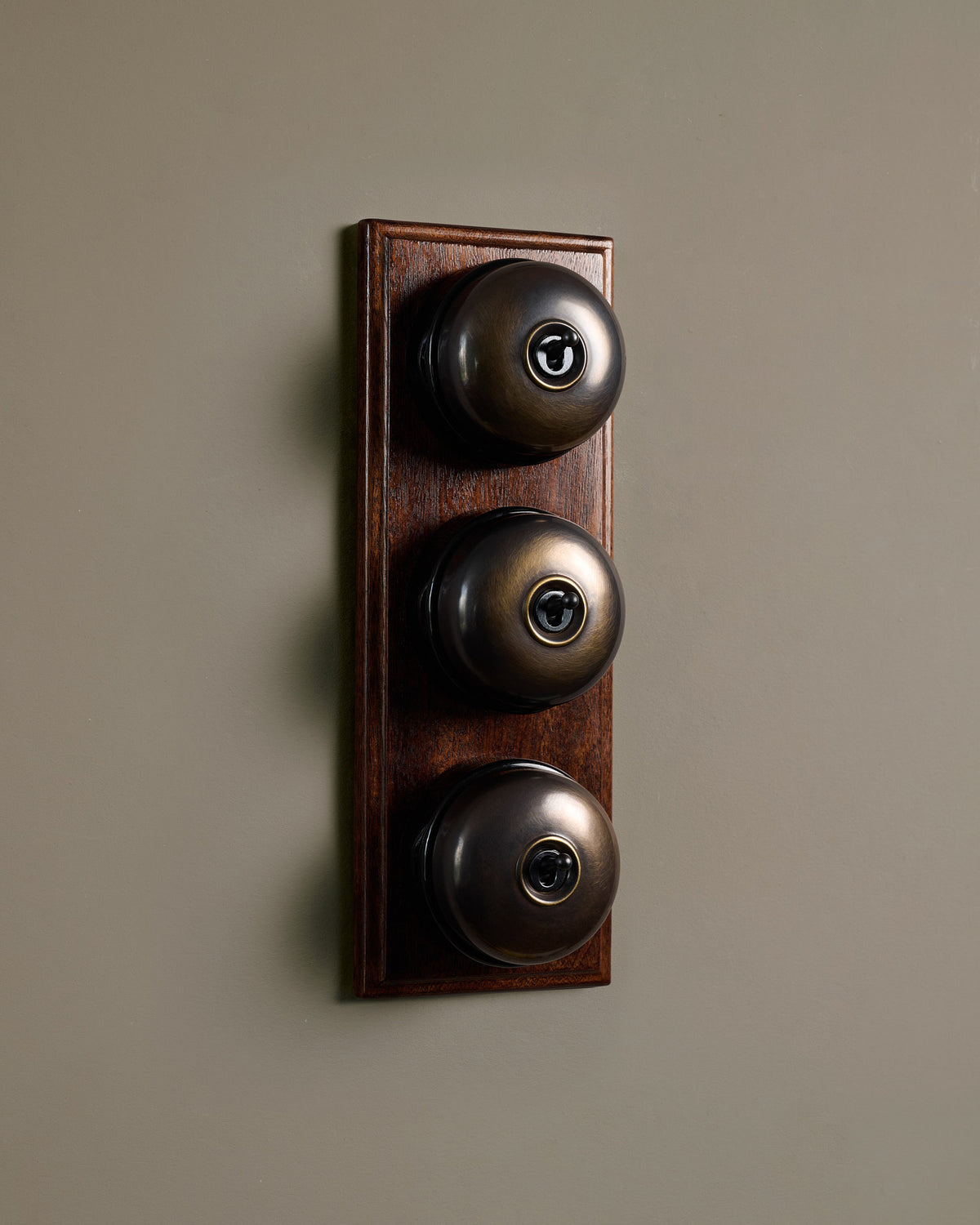 The Dolly Toggle Switch (3 Gang & Mahogany Finish Pattress) - Oxidised Brass with Black Base. TEST