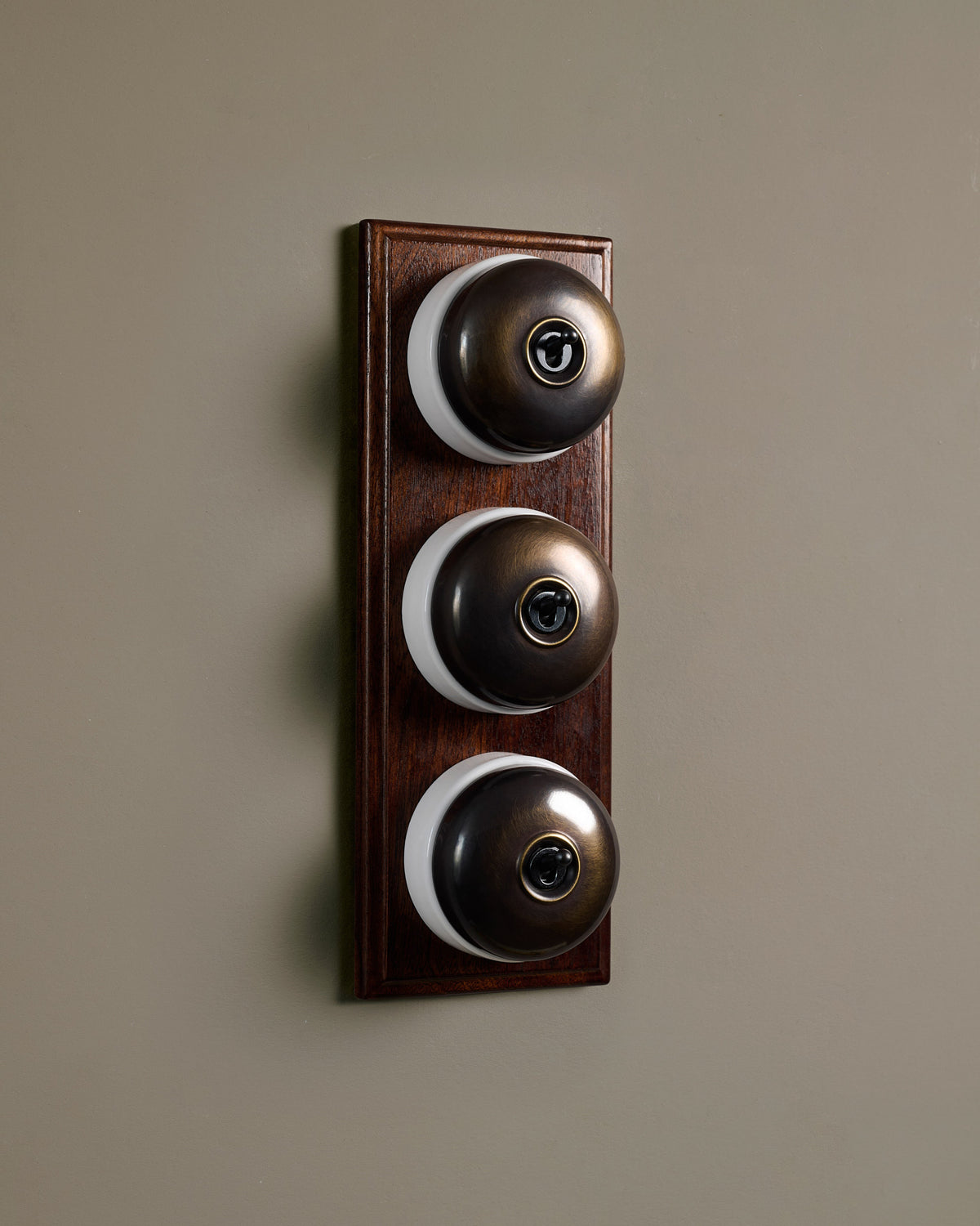 The Dolly Toggle Switch (3 Gang & Mahogany Finish Pattress) - Oxidised Brass with White Base. TEST