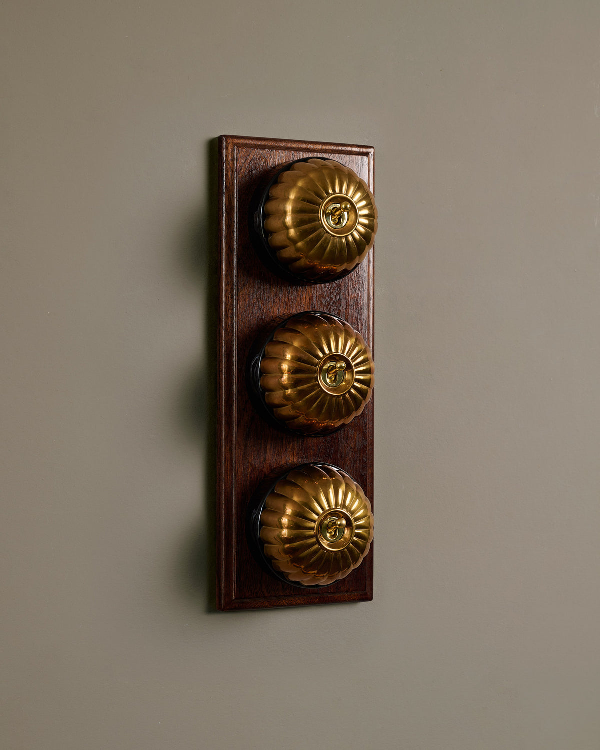 The Jelly Toggle Switch (3 Gang & Mahogany Finish Pattress) - Heirloom Brass with Black Base. TEST