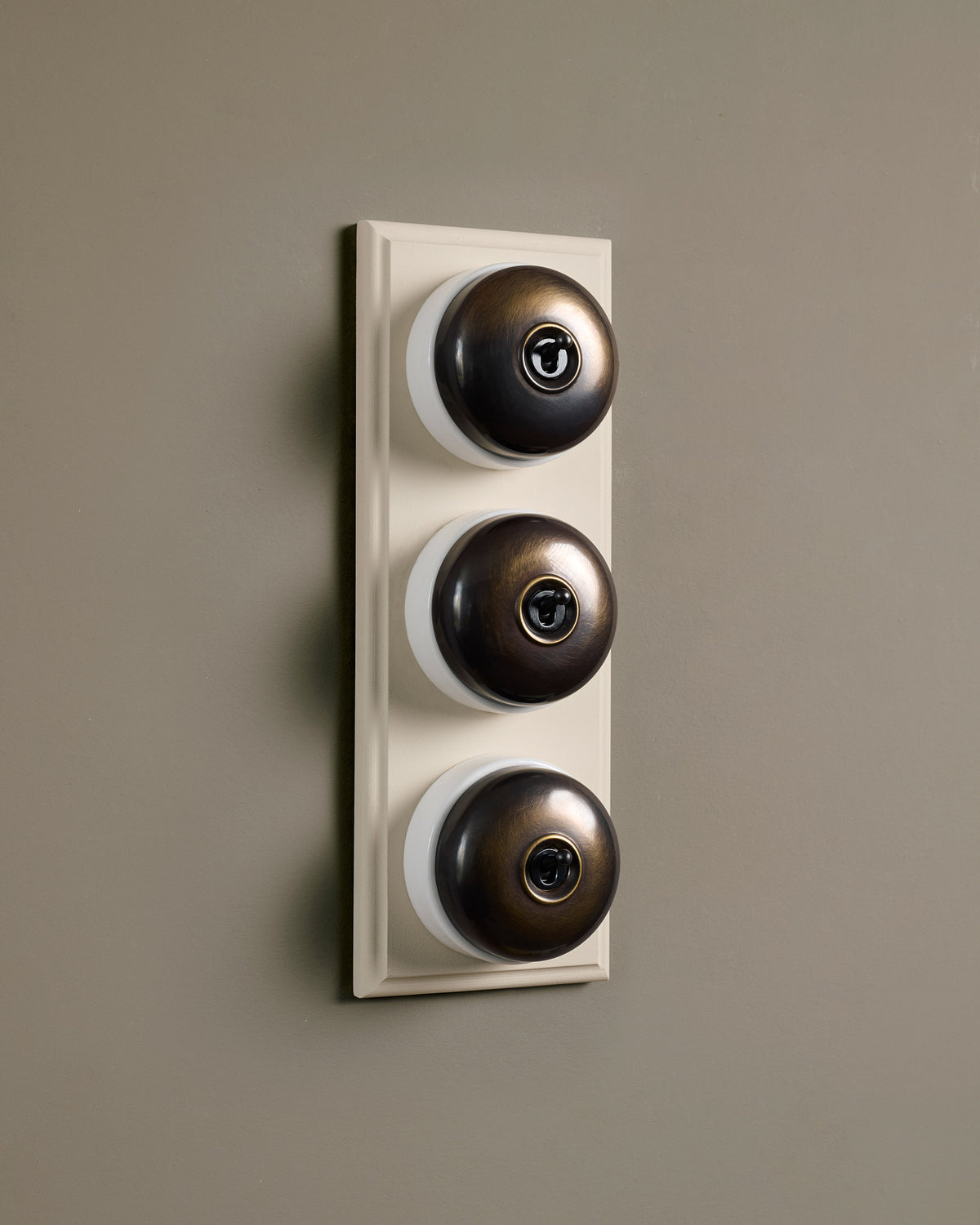 The Dolly Toggle Switch (3 Gang & Primed Maple Pattress) - Oxidised Brass with White Base. TEST