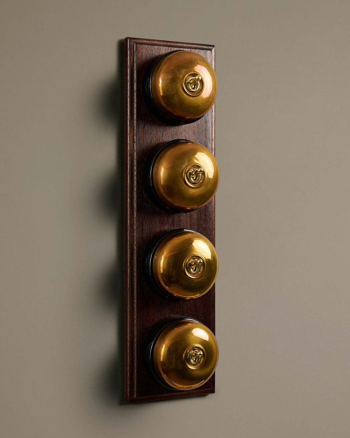 The Dolly Toggle Switch (4 Gang Row & Mahogany Finish Pattress) - Heirloom Brass with Black Base. TEST