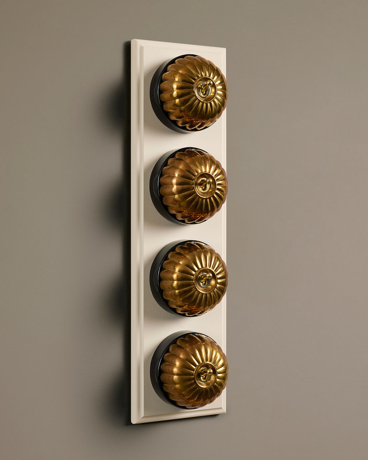 The Jelly Toggle Switch (4 Gang Row & Primed Maple Pattress) - Heirloom Brass with Black Base. TEST