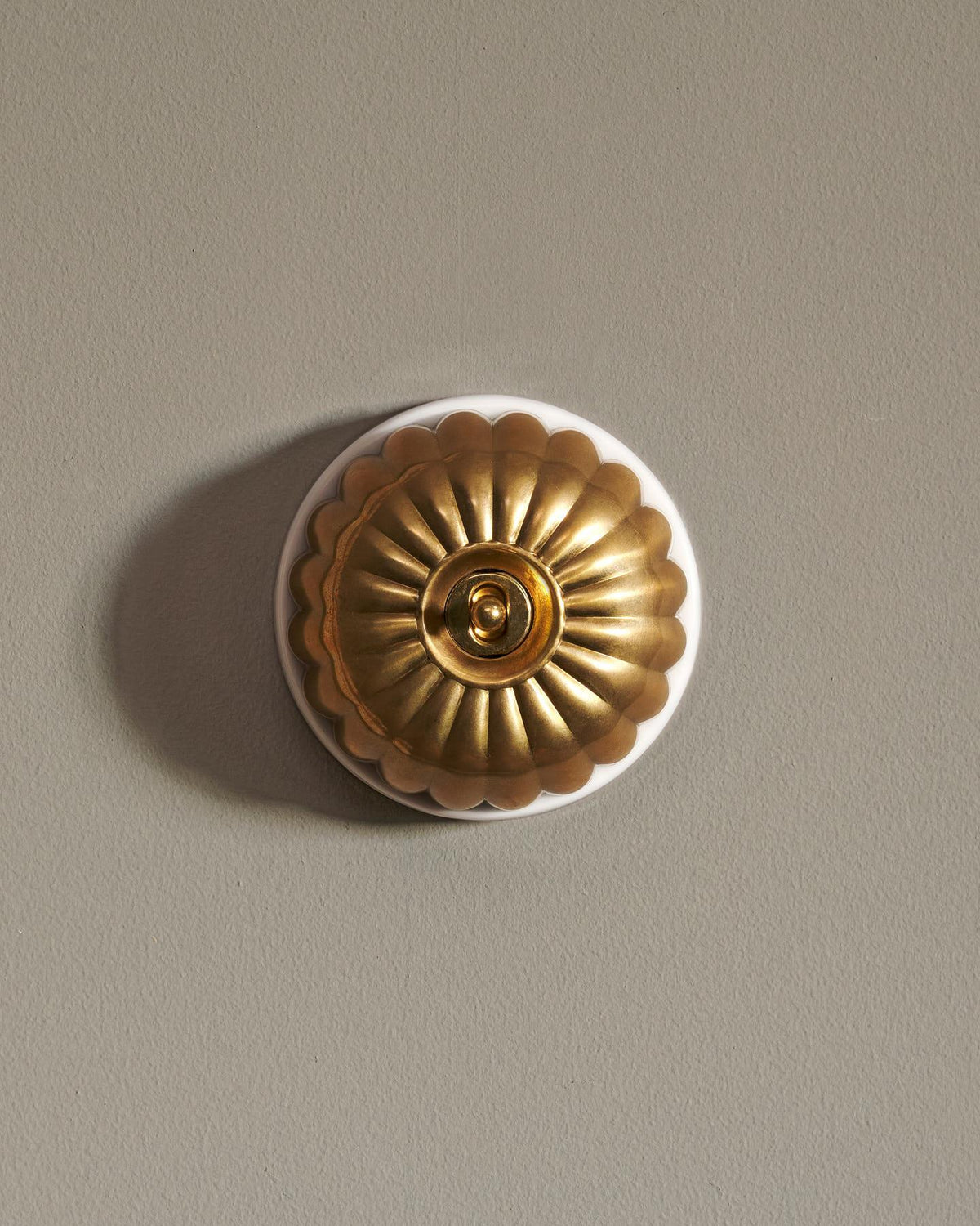 The Jelly Toggle Switch - Heirloom Brass, White Base, Retract to Centre TEST