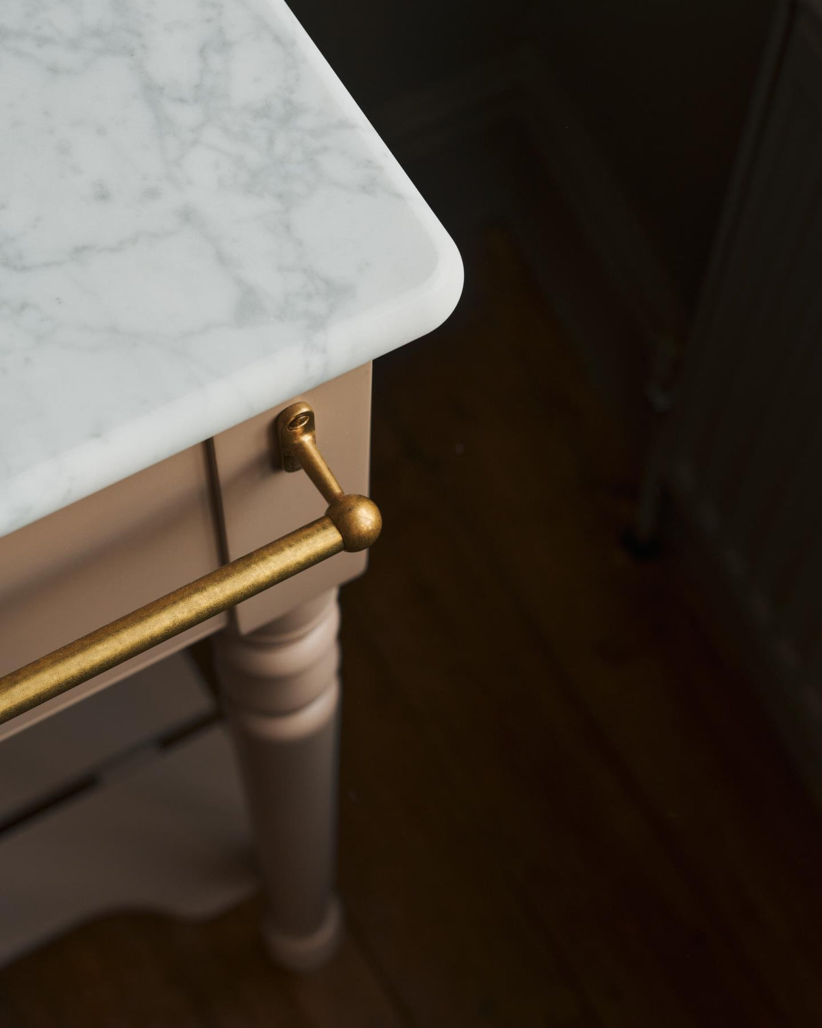 A front profile view of an aged brass mixer tap with crosshead handles for a bathroom basin sink. | Front Towel Rail shown TEST