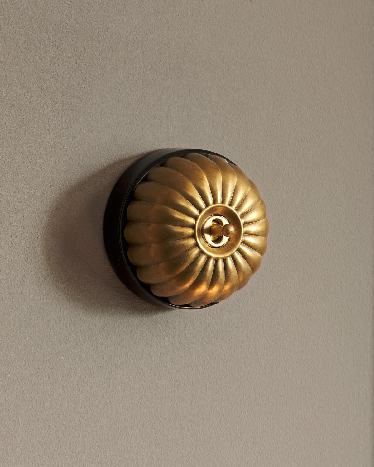 The Jelly Toggle Switch - Aged Brass, Black Base, Retract to Centre TEST