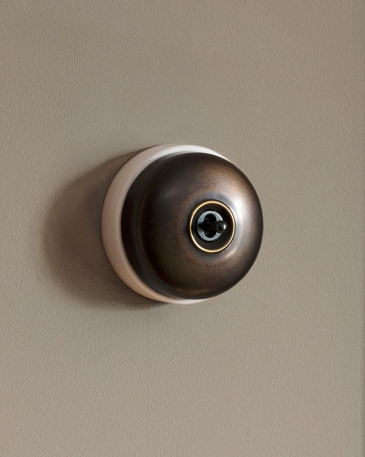 The Dolly Toggle Switch - Oxidised Brass, White Base, Retract to Centre TEST