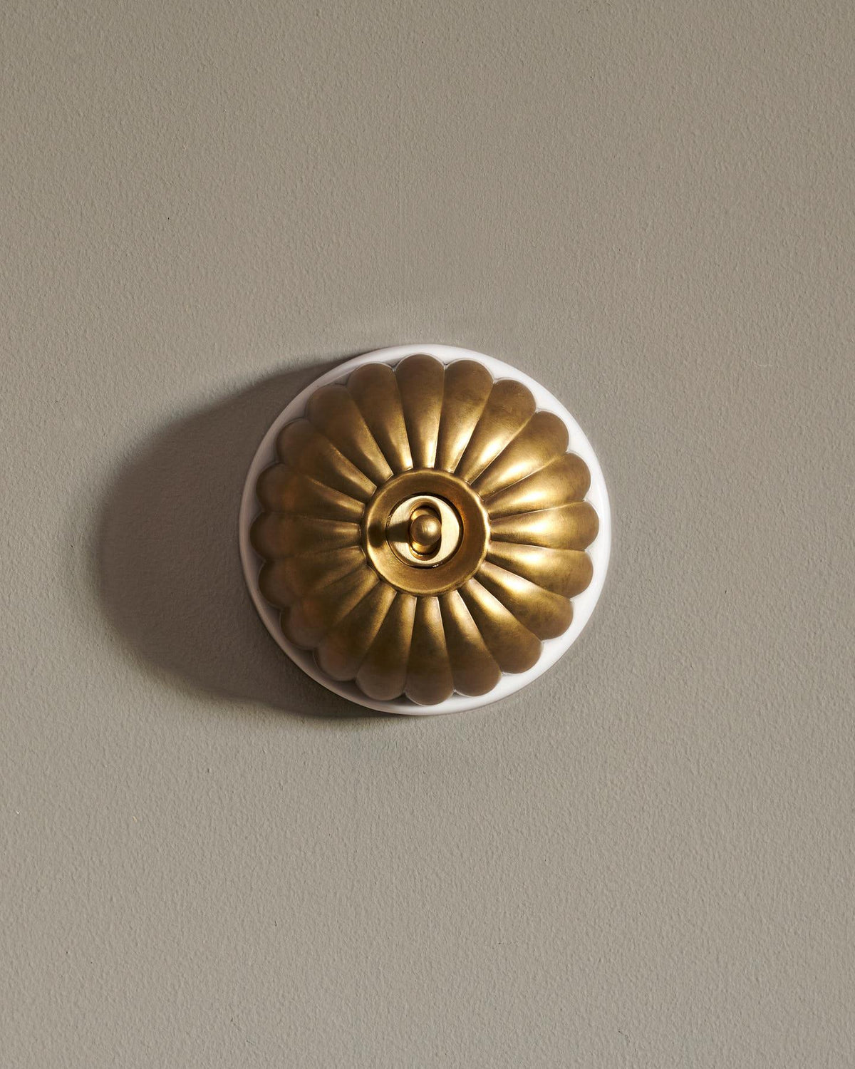 The Jelly Toggle Switch - Aged Brass, White Base, Retract to Centre TEST