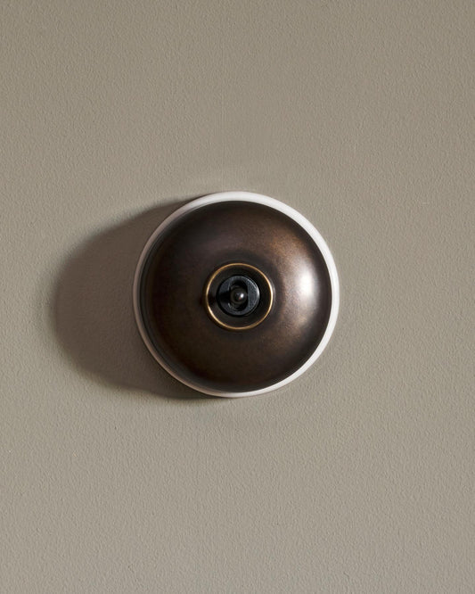 The Dolly Toggle Switch - Oxidised Brass, White Base, Retract to Centre