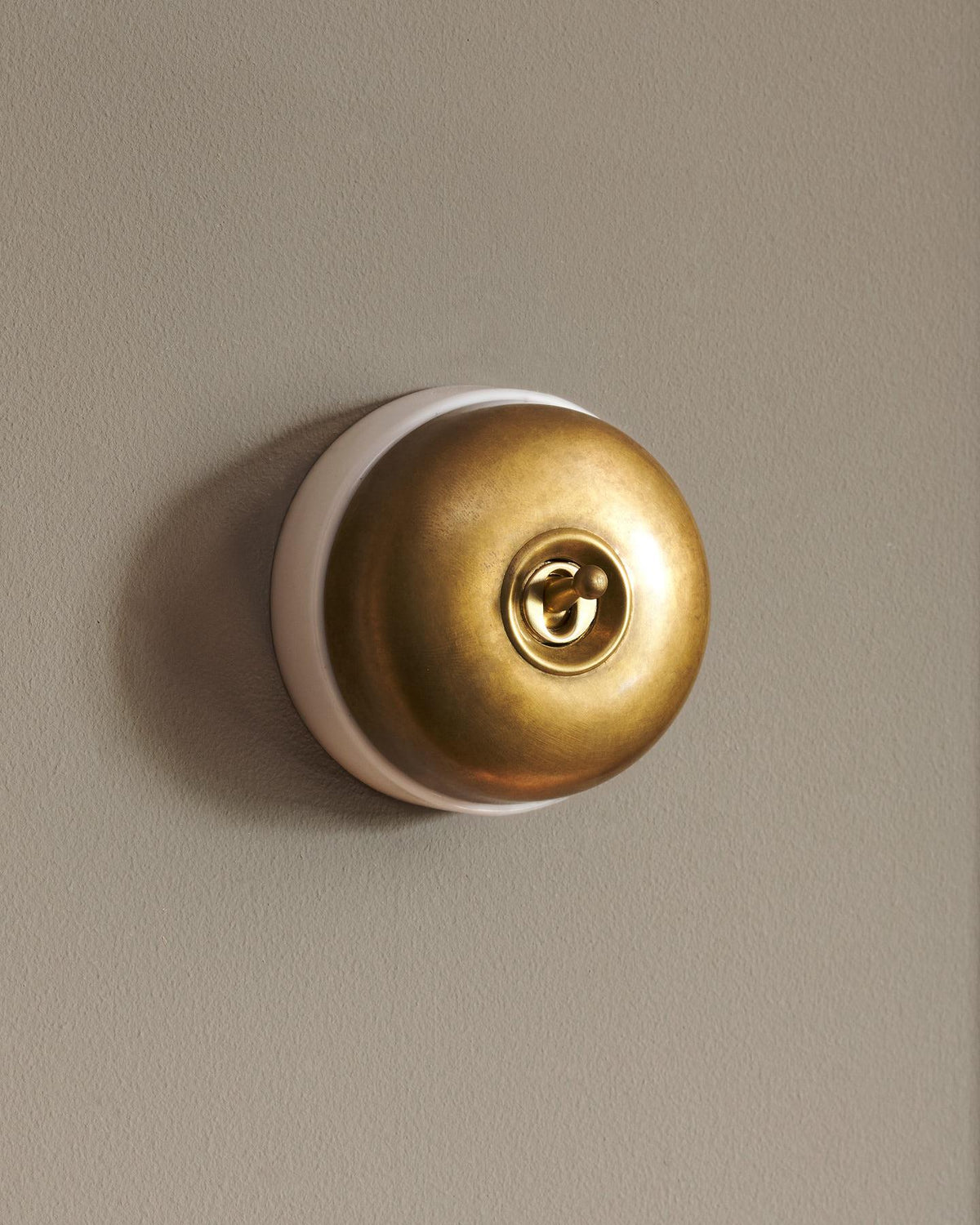 The Dolly Toggle Switch - Aged Brass, White Base, Intermediate TEST
