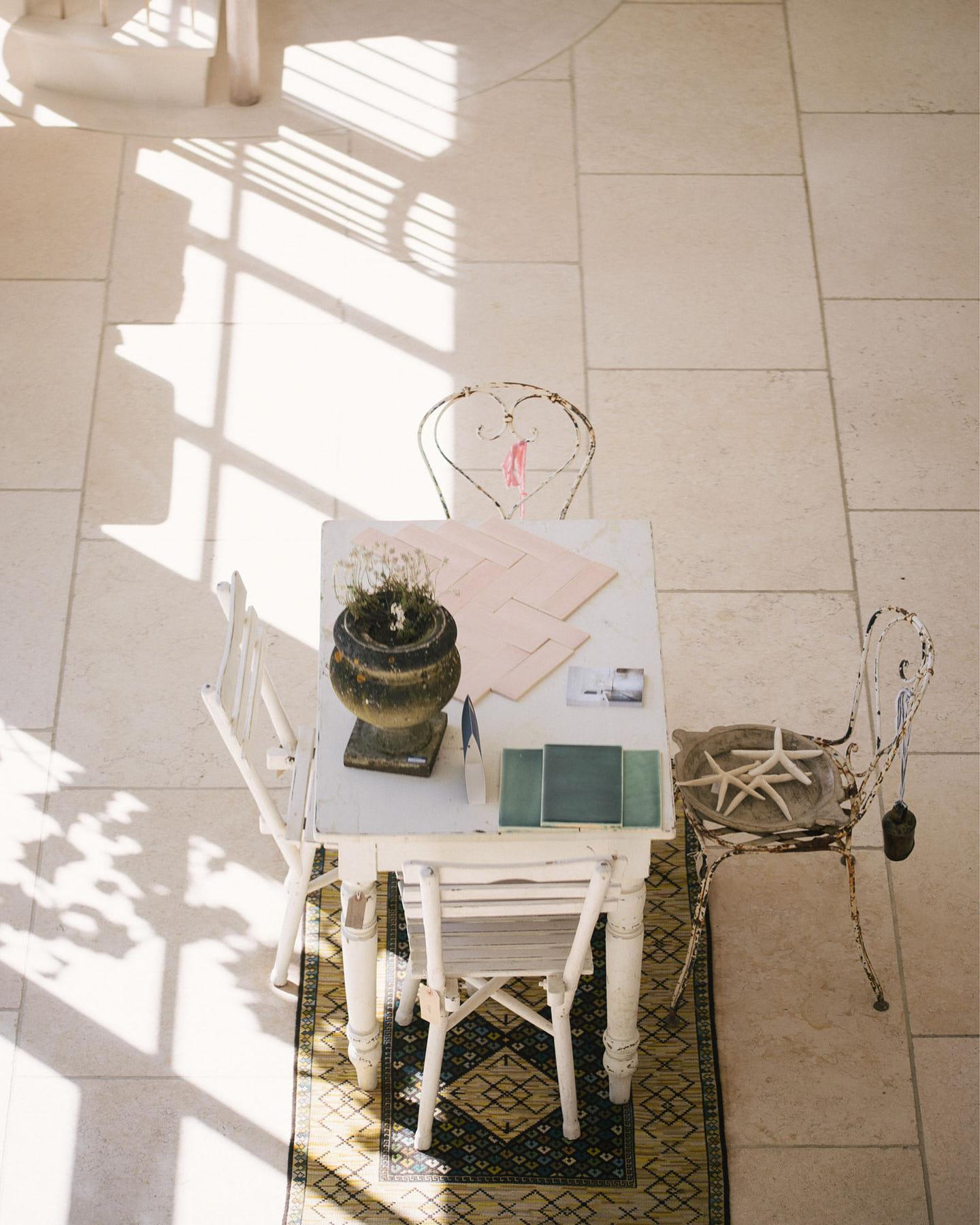 A close-up overhead view of Light Jerusalem Limestone flooring, showing the mottled cream colour and smooth texture.