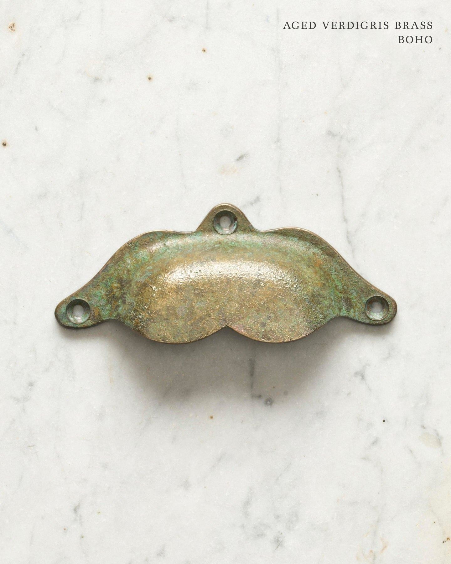 Two bohemian-style cup handles for a kitchen cupboard or drawer with an aged verdigris brass finish. There is a large and a small size.