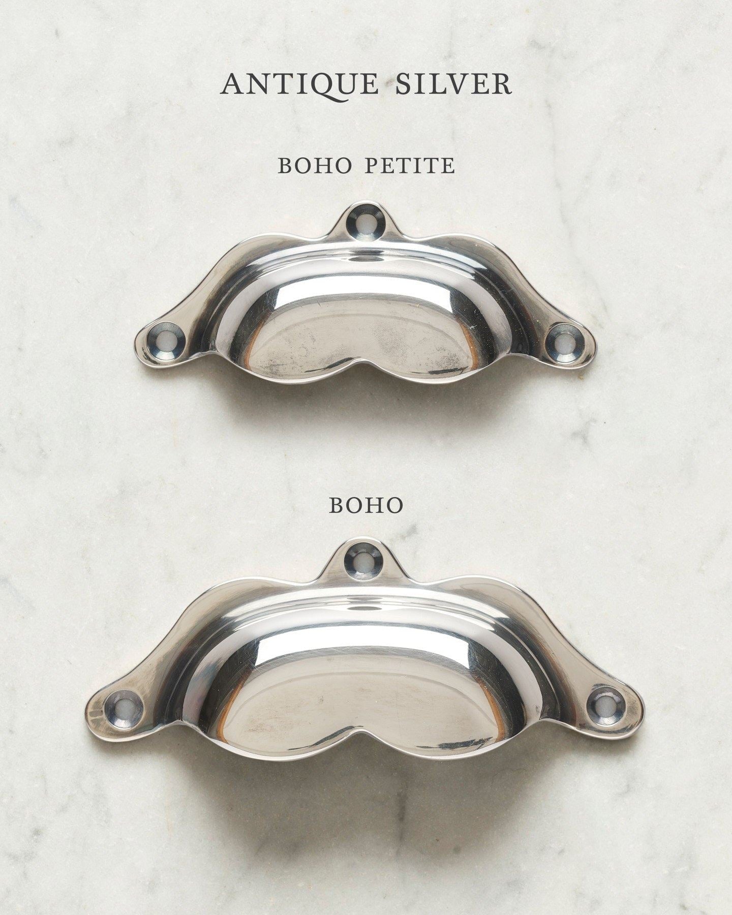 Two bohemian-style cup handles for a kitchen cupboard or drawer with a tarnished silver finish. There is a large and a small size.
