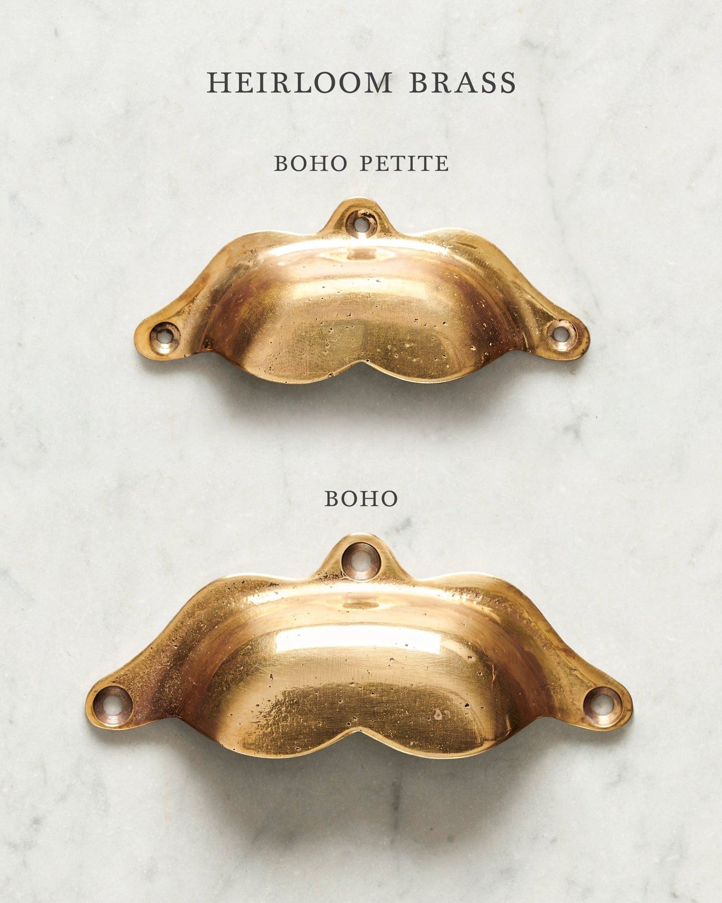 Two bohemian-style cup handles for a kitchen cupboard or drawer with a warm burnished brass finish. There is a large and a small size.