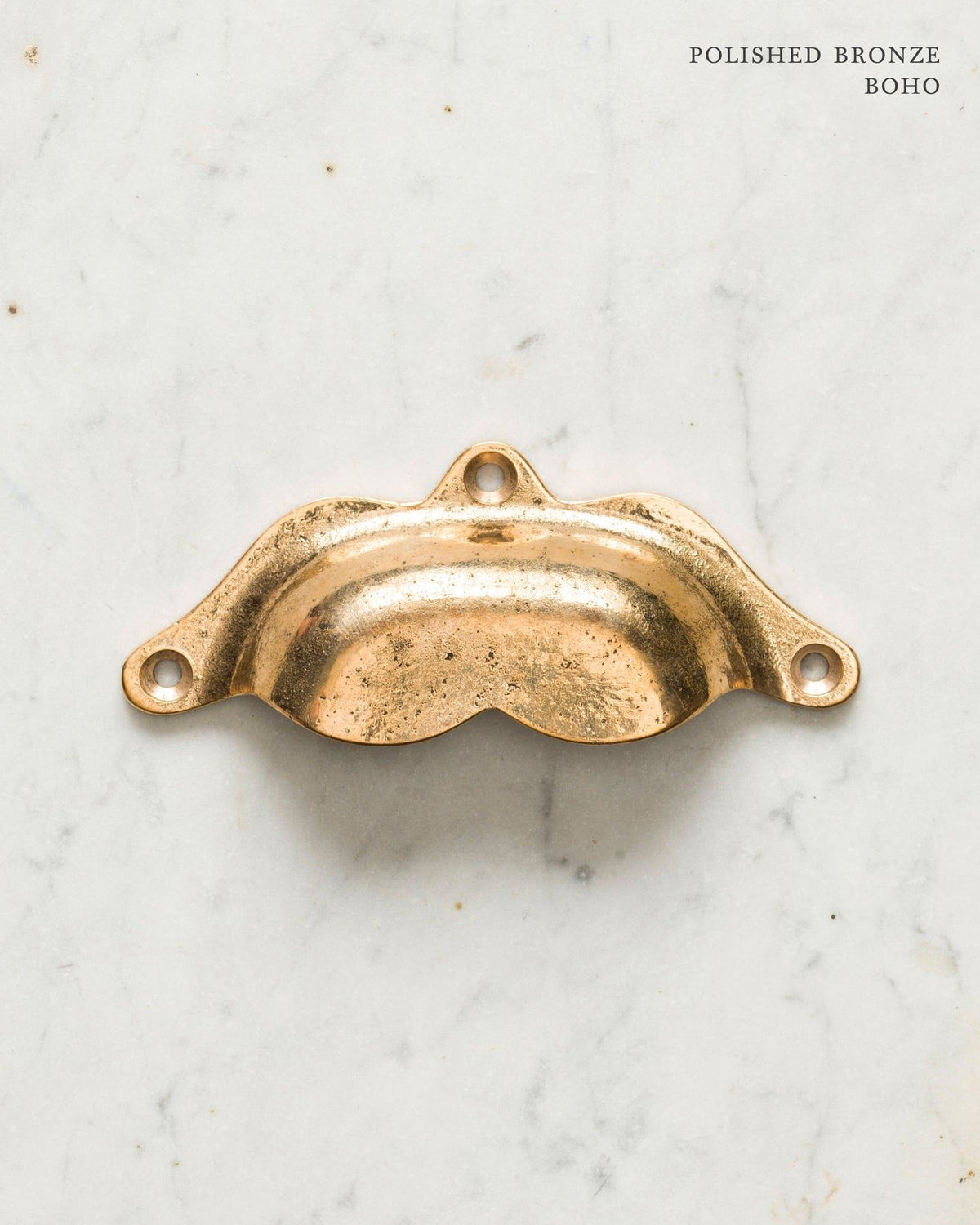 Two bohemian-style cup handles for a kitchen cupboard or drawer with a bright polished bronze finish. There is a large and a small size. TEST