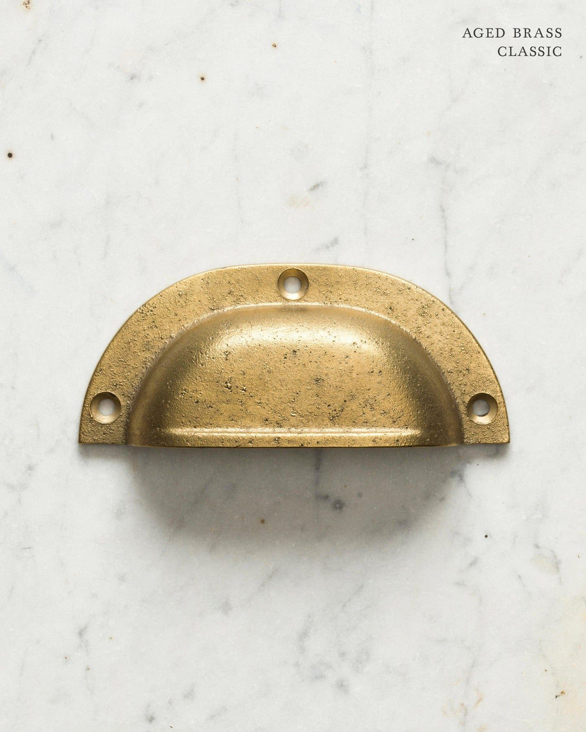 Two classic cup handles for a kitchen cupboard or drawer with an aged brass finish. There is a large and a small size. TEST