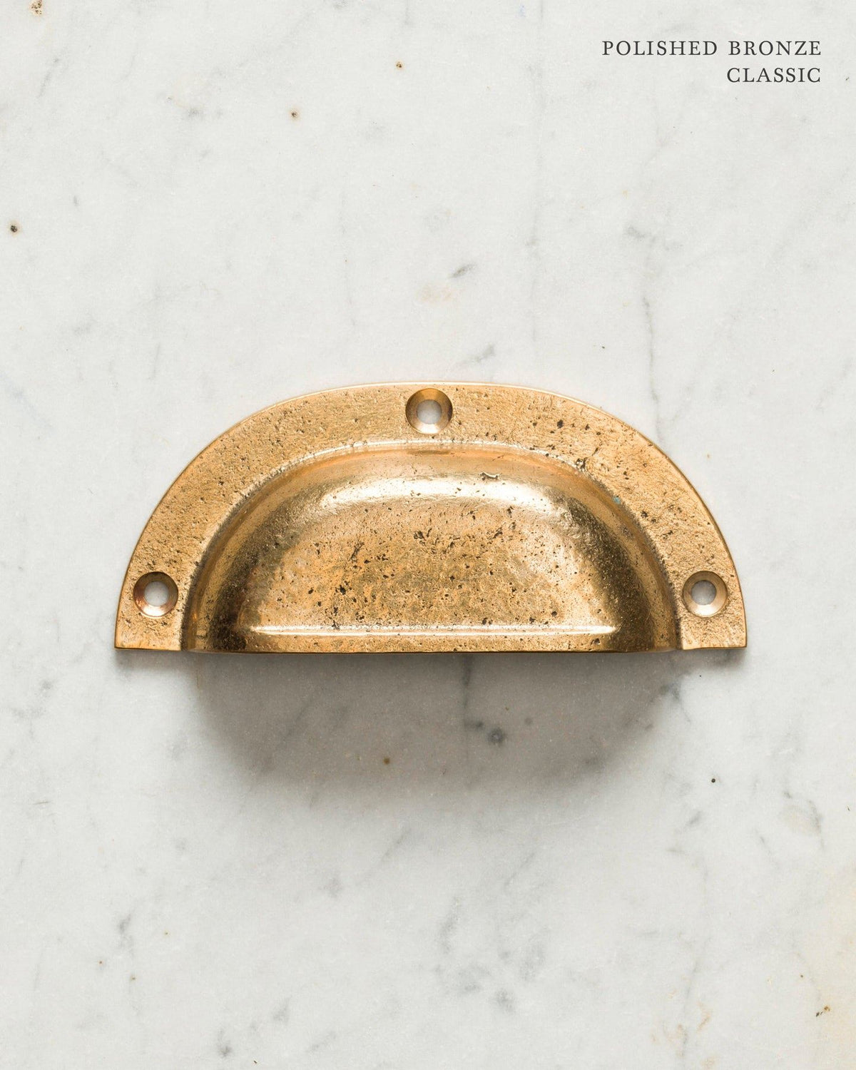 Two classic cup handles for a kitchen cupboard or drawer with a bright polished bronze finish. There is a large and a small size. TEST
