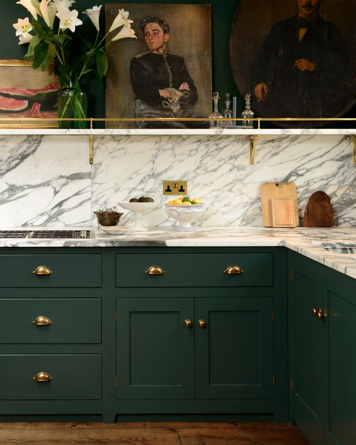 A straight-on view of a racing green painted Georgian-style kitchen with simple cup handles and round doorknobs in a burnished 'Bella' brass finish.|Bella Brass Medium shown TEST