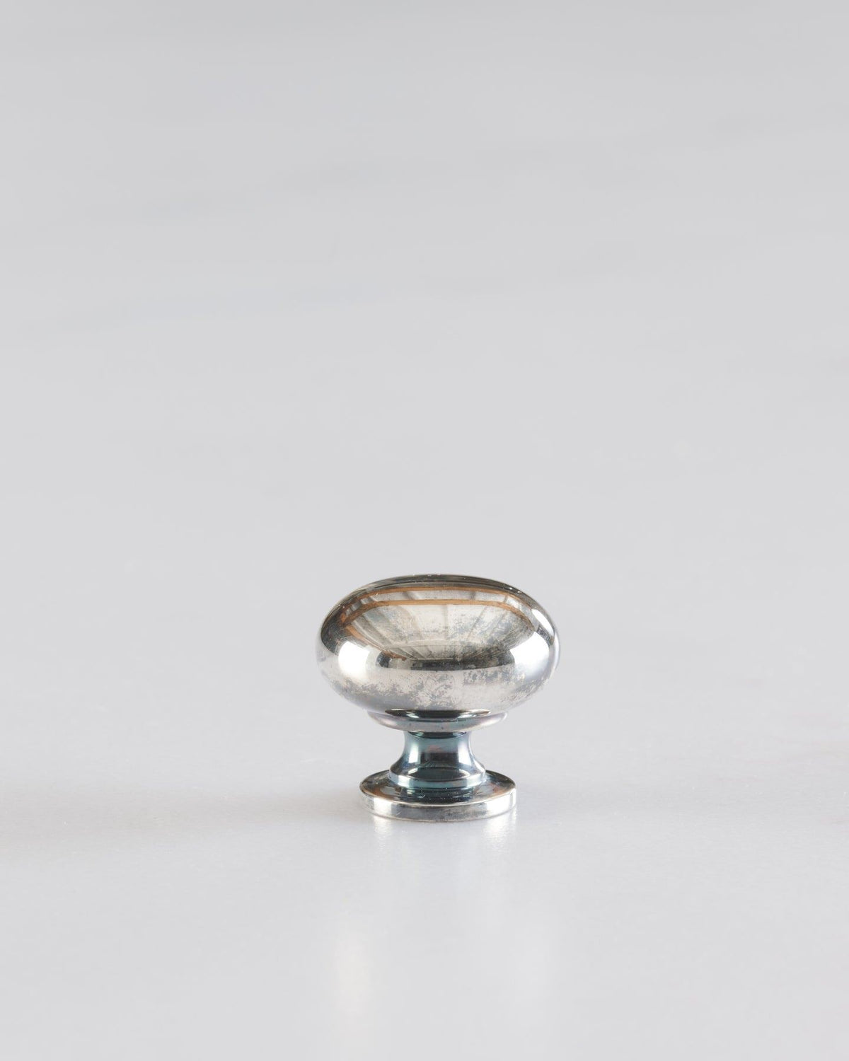 A 'Petite' classic knob for a kitchen cupboard or drawer with a tarnished silver finish. TEST