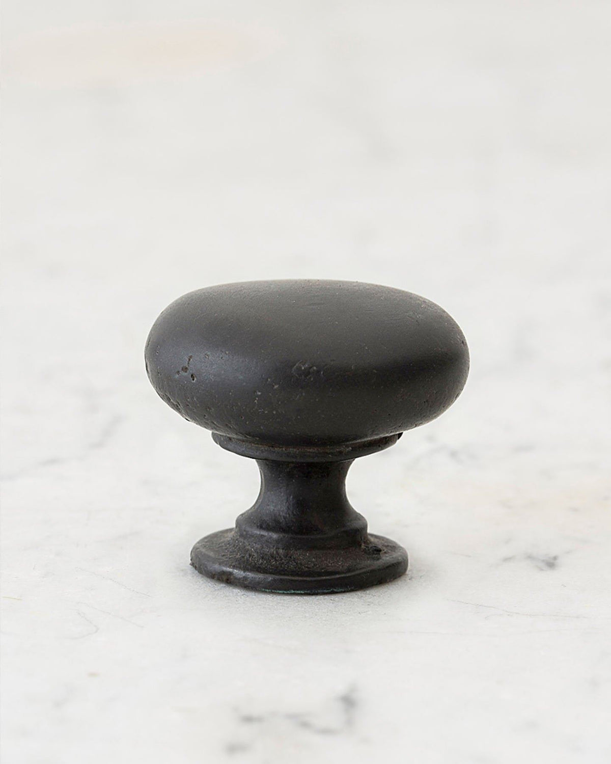 A 'Large' classic knob for a kitchen cupboard or drawer with a matt black bronze finish that makes it look like a beloved, well aged brass from centuries ago. TEST