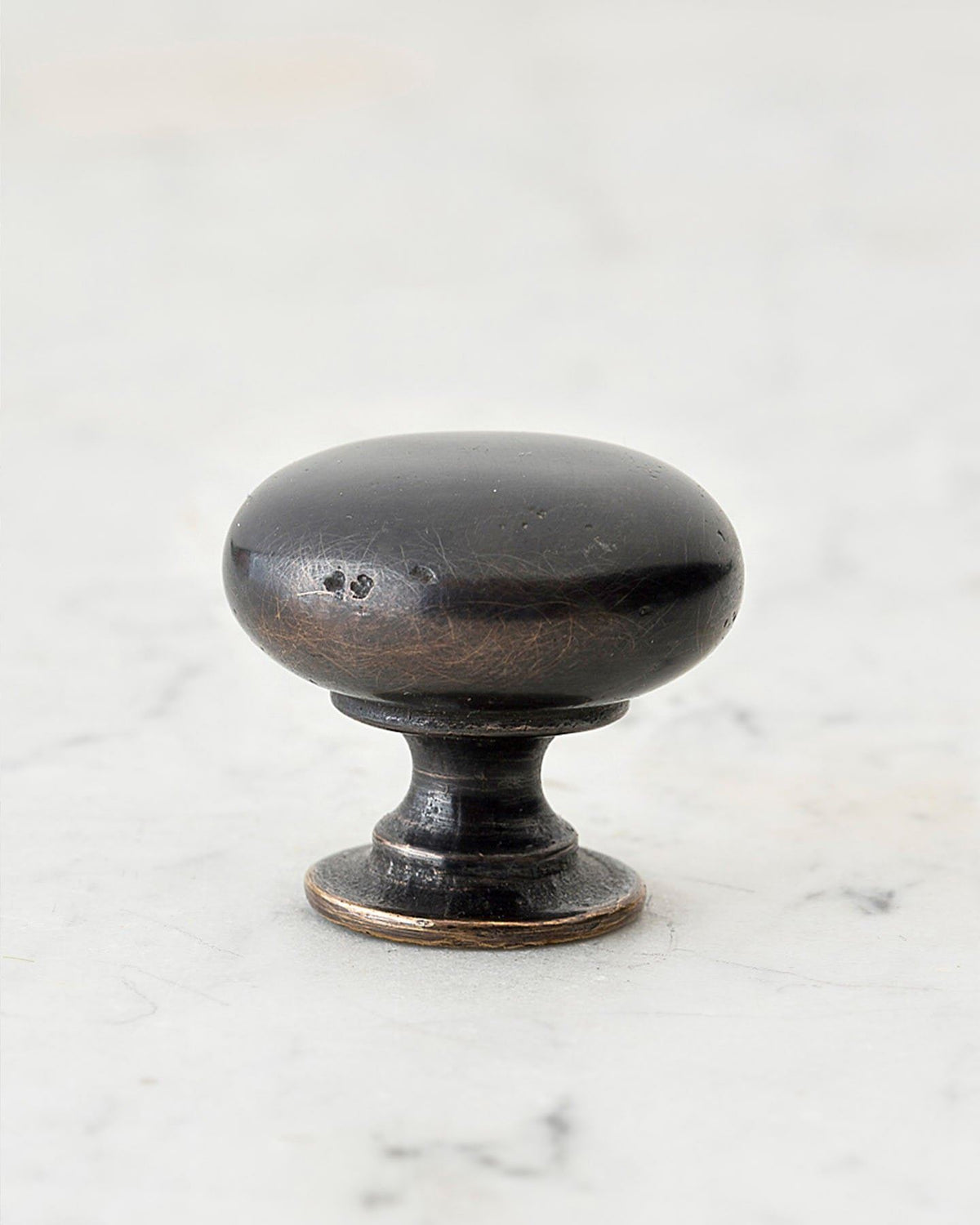 A 'Large' classic knob for a kitchen cupboard or drawer with a dark oxidised bronze finish and unique dented textures as if was made by an artisan blacksmith centuries ago. TEST